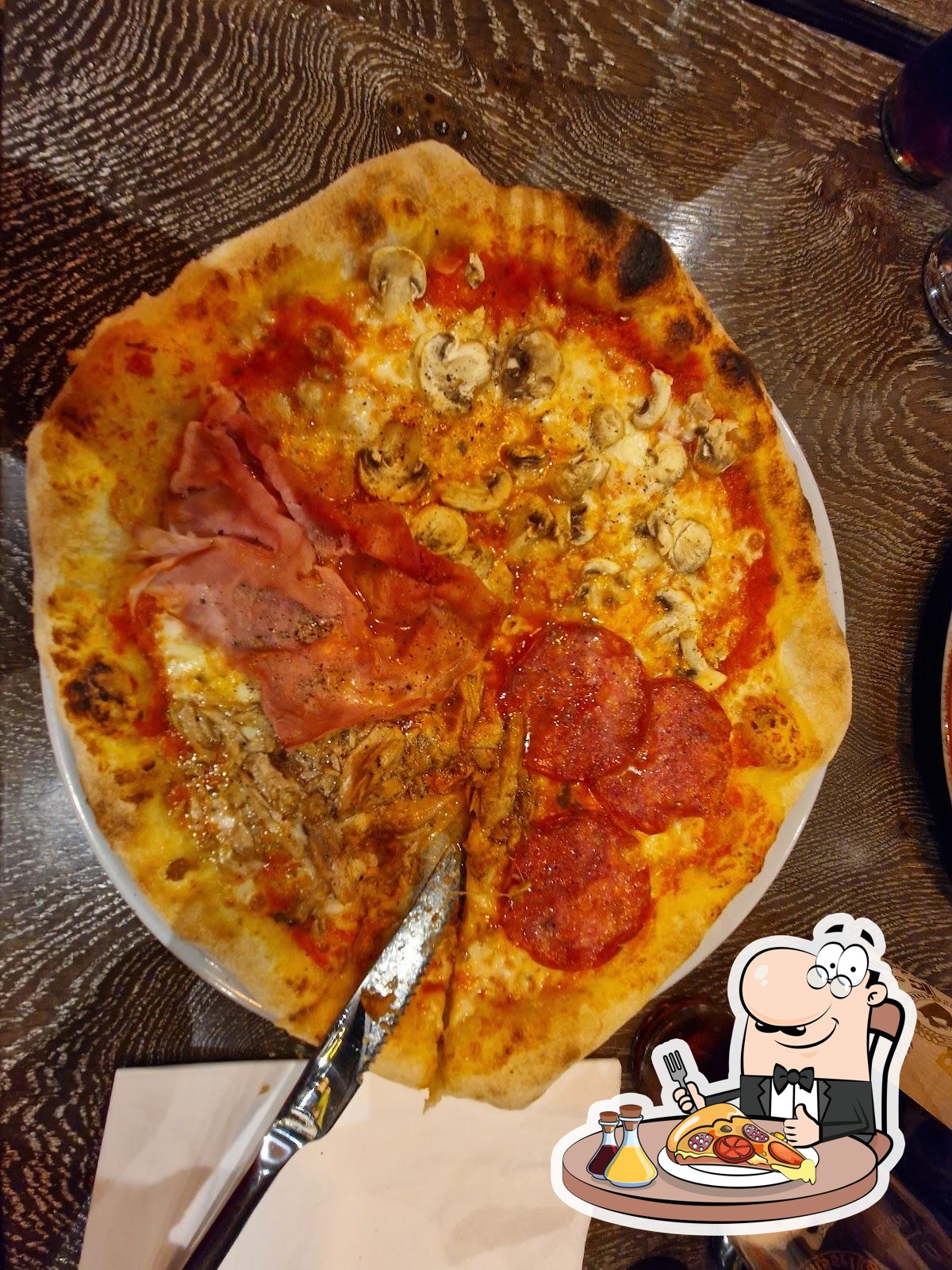 Попробуйте пиццу в "Trattoria Abbraccio".