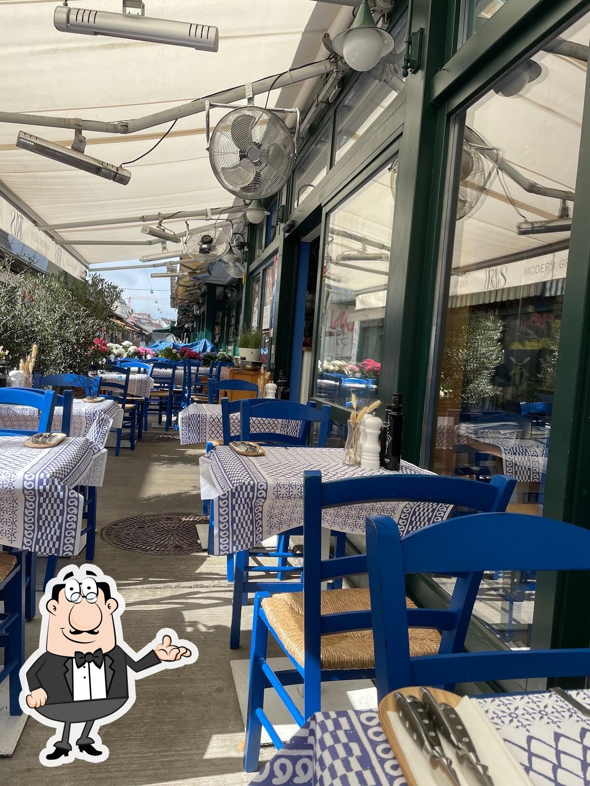 Посмотрите на внутренний интерьер "Iris Modern Greek Restaurant".
