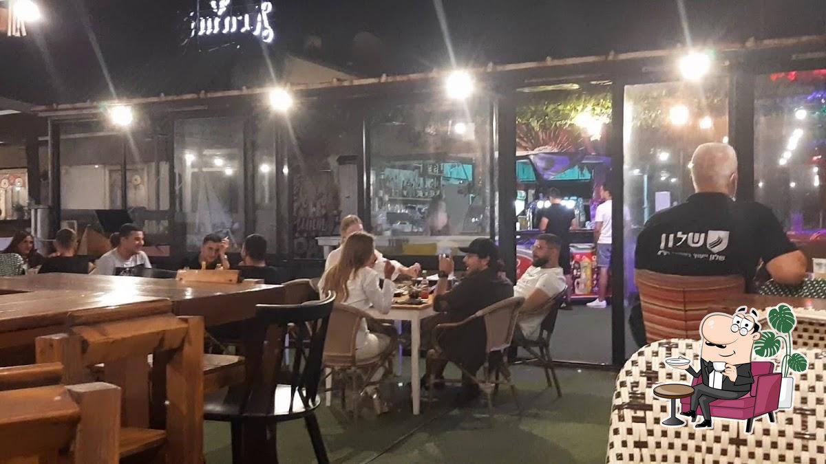 Забронируйте столик в "תוכי TUKI".