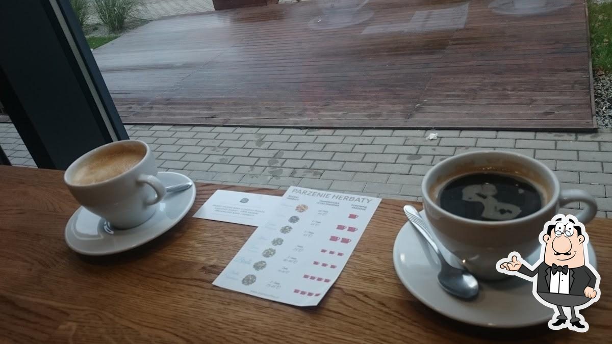 Посмотрите на внутренний интерьер "Aroma Café Specialty Coffee".
