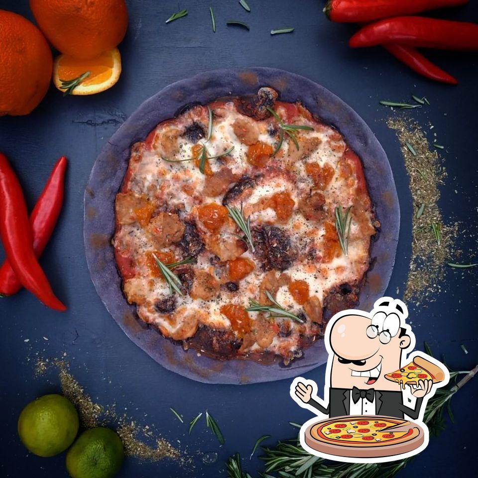 В "Camorra Pizza E Birra" вы можете попробовать  пиццу.