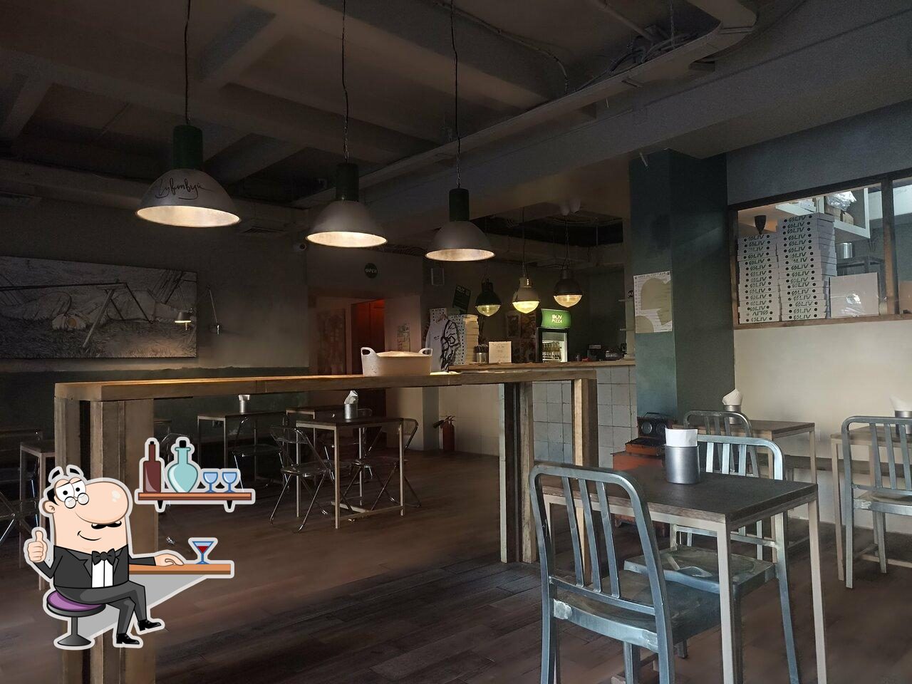 Посмотрите на внутренний интерьер "Øliv Pizza".