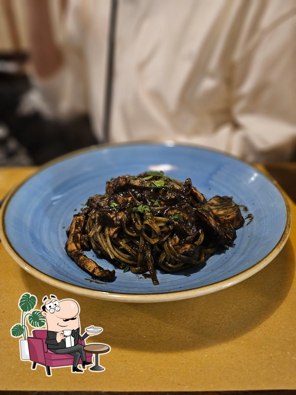 Посмотрите на внутренний интерьер "Osteria Al Portego".