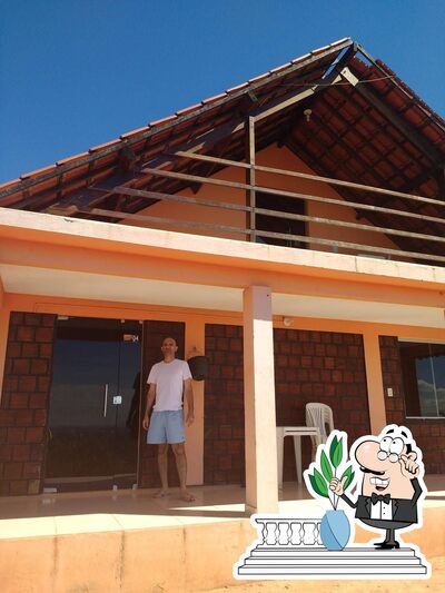 Você pode espairecer no na área externa do Nas Alturas Restaurante e Chalés