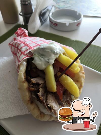 Prenez un hamburger à Guma Restaurant