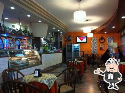 Siediti a un tavolo di Zenith Pizza