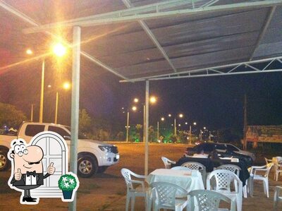 Você pode espairecer no exterior Pizzaria nosso canto